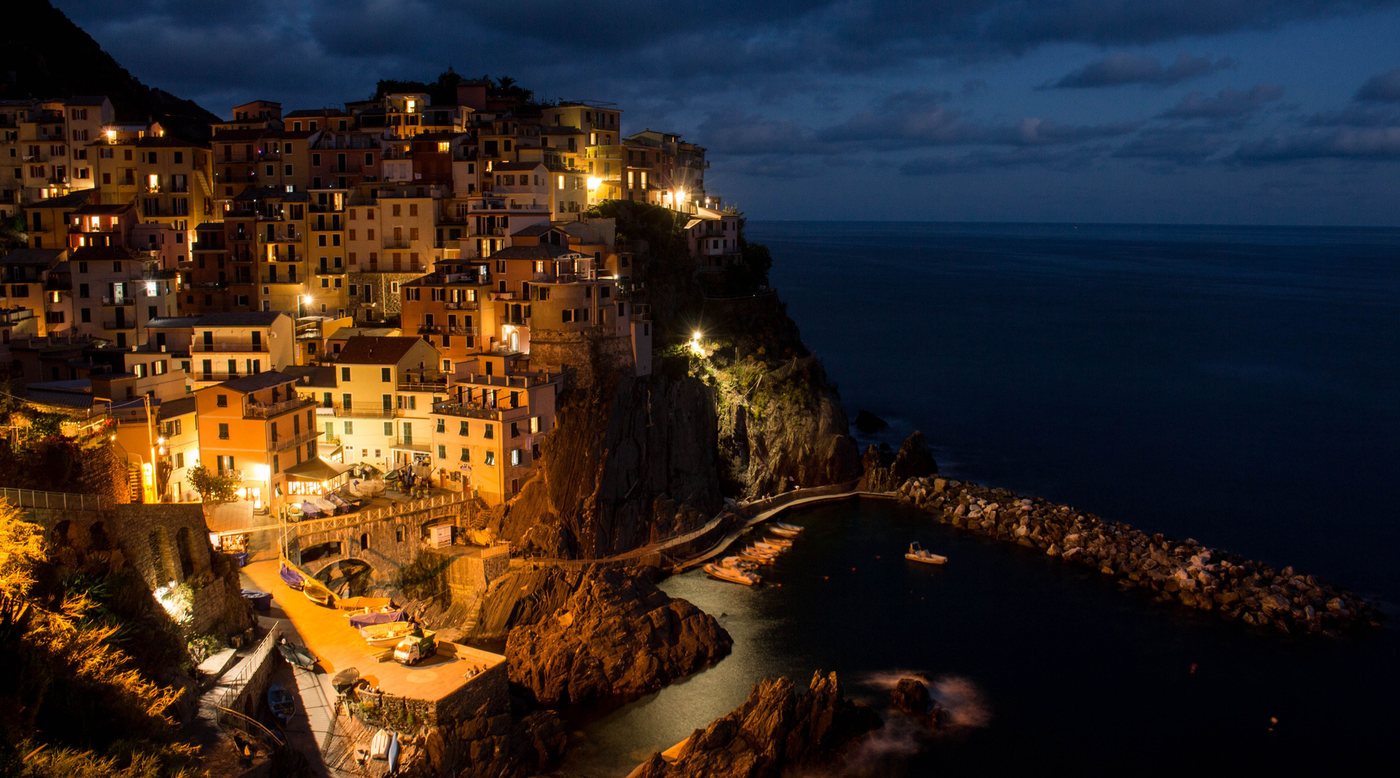 A small hotel above the water at dusk