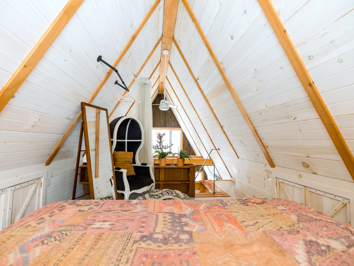 Attic suite: beams under the roof, two windows