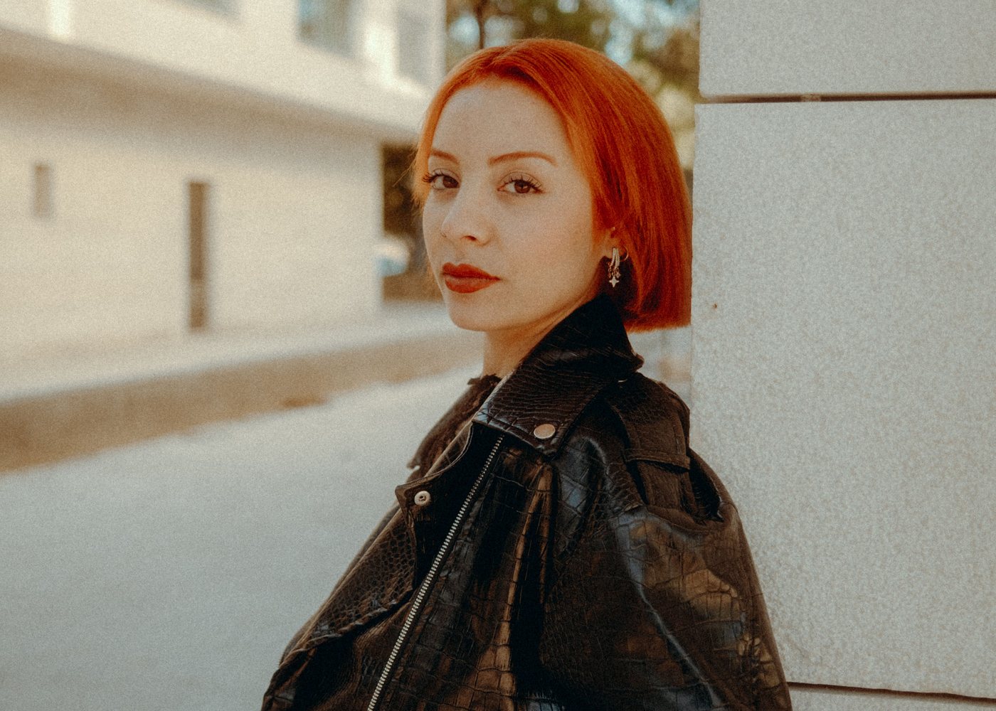 Wearing the waxed jacket on a street corner